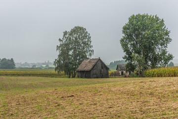 Old wooden building on a farm in Brusy commune, Cassubia region of Poland