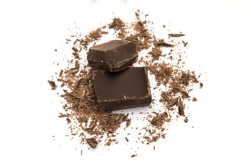 pieces of black chocolate on white background