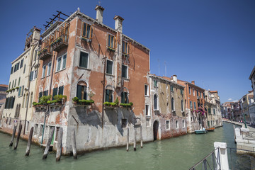  Colored buildings over canal in Venice, Italy.