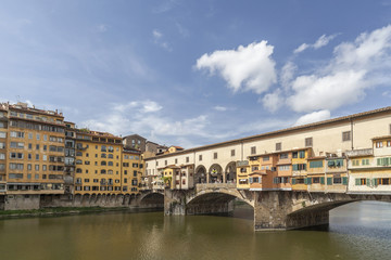 Fototapeta na wymiar Iconic monument, bridge, Ponte Vecchio, medieval stone construction over Arno river. Tuscany, Italy.