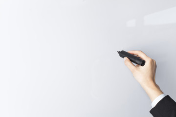 Hand with a marker on a white background