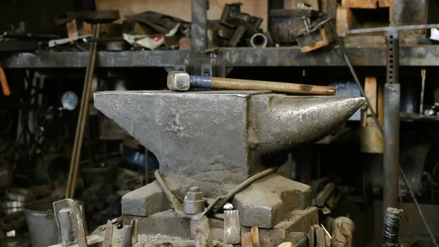 Hammer on anvil in the blacksmith's shop.