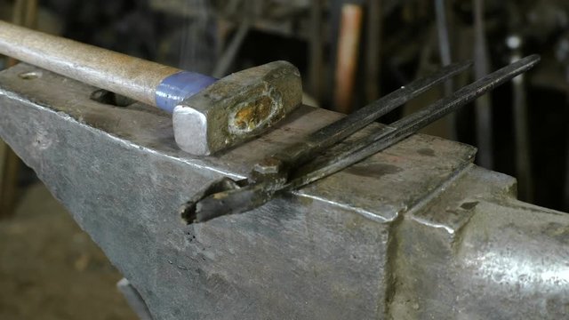 Hammer on anvil in the blacksmith's shop.