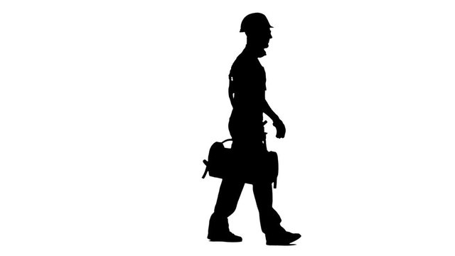 Working builder goes to work with a suitcase with tools. White background. Silhouette. Side view