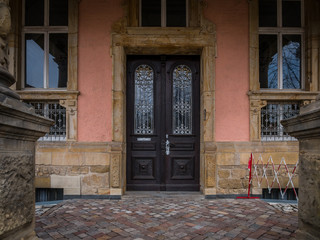 The old and vintage wooden door of a building