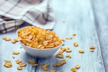 Cornflakes.  Dish of cornflakes on kitchen table