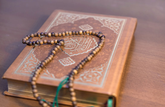 Muslim rosary beads on the Holy Quran