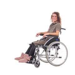 Fototapeta na wymiar Young woman in a wheel chair