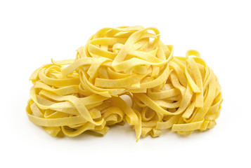 Fettuccine pasta classic raw isolated on white background three pieces