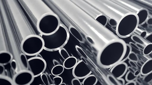 Industry business production and heavy metallurgical industrial products, many shiny steel pipes, industrial background, manufacturing business production concept with selective focus effect. 4k 3D