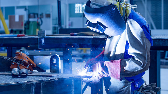 Welding with sparks by Process fluxed cored arc welding , Welding by Welder Thailand , Welder welding steel structure. - Powered by Adobe
