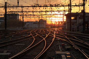 Naklejka na ściany i meble Empty railroad tracks during a nice sunrise at Gare de Lyon-Perrache. Lyon, France.