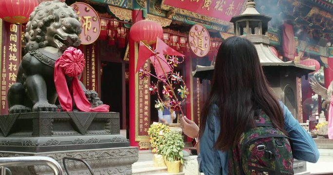Woman visiting Wong Tai Sin temple