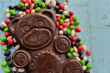 Delicious seasonal Sweets: chocolate figure bears and a lot of candy. The concept of Easter sweets.