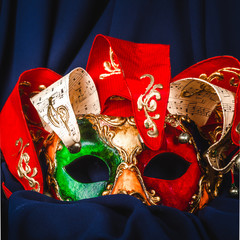 Venetian carnival mask in red green and yellow