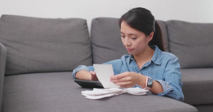 Woman calculate the use of daily life at home