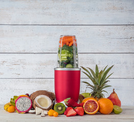 Smoothie maker mixer with pieces of fruit ingredients