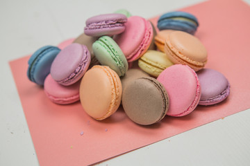 sweet french macaroon on white isolated white background. fly falling sweet macaroni