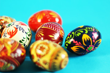 Isolated traditional Easter eggs, selective focus, blue background