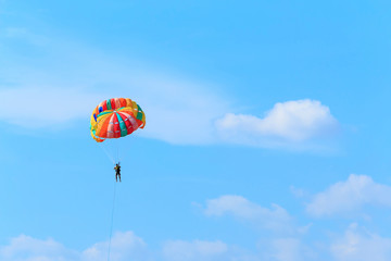 Man playing parasailing.