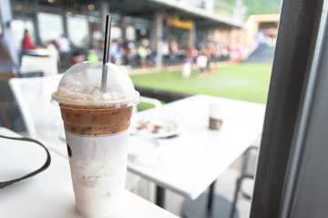 Iced coffee latte on table in cafe.