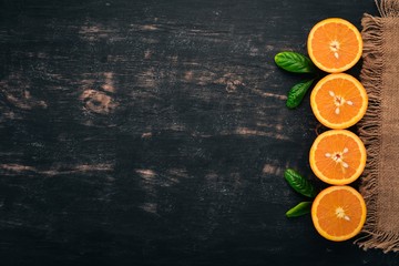 Fresh Orange. Fruits. On a wooden background. Top view. Copy space.