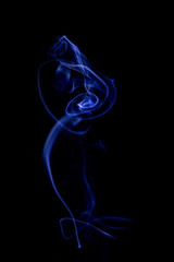 Blue Smoke on black background for art design or pattern.,Line abstract background., Smoke incense.,