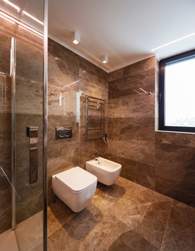 Luxurious marble bathroom with window