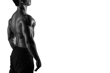 Highly retouched fitness model and bodybuilder. Posing his back muscles. looking high. concept of self-confidence and power. Isolated on white background. Copy space. Black and white.