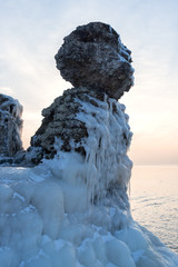 Ice on abandoned forifications at Baltic sea coast in winter evening, Liepaja, Latvia.