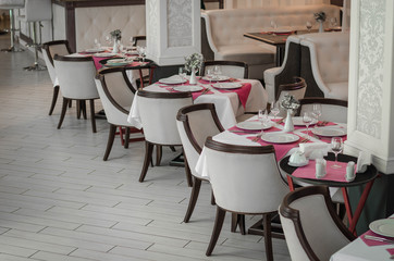 Served dinner table in a restaurant. Restaurant interior. Cozy restaurant table setting