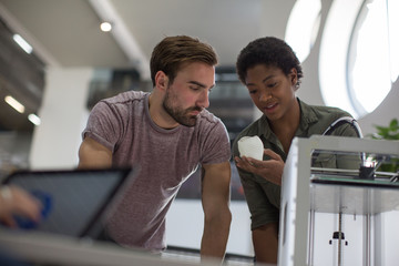 Team working with 3d printer