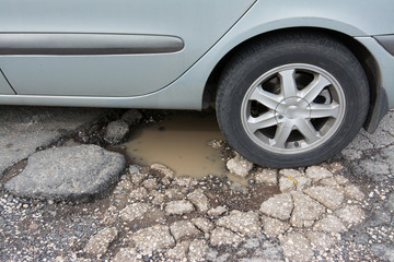 Big pothole caused by freezing and rain in Rome, Italy