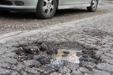 Big pothole caused by freezing and rain in Rome, Italy