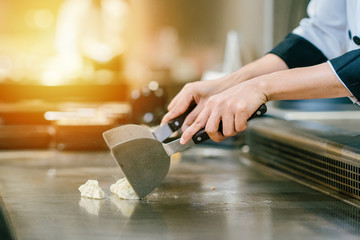Hand of man take cooking of meat with vegetable grill, Chef cooking wagyu beef in Japanese teppanyaki restaurant