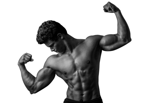 Highly retouched black and white fitness model and bodybuilder posing the biceps, shoulder, chest and abs. concept of strength and power. Isolated on white background. Copy space.