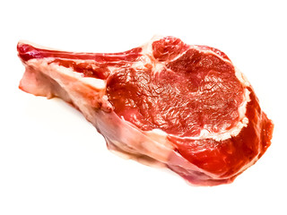 Rib eye on the bone or cowboy steak of beef or veal on a white background with shadow