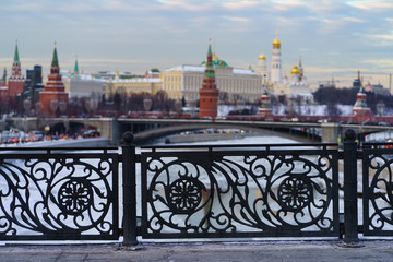 Winter Moscow city view through a carved fence
