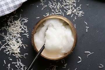 Top down view of Coconut oil, coconut flakes