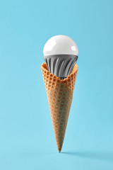 Led lamp in ice cream cone, innovation concept