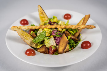 Pasta with vegetables on plate, traditional Italian food, pasta, tomatoes, rucola