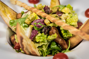 Pasta with vegetables on plate, traditional Italian food, pasta, tomatoes, rucola