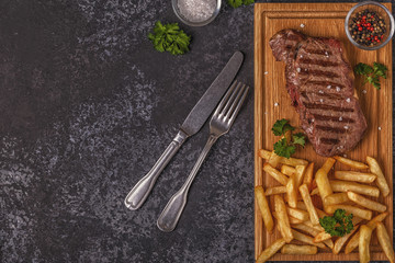Beef barbecue steak with french fries.