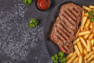 Beef barbecue steak with french fries.