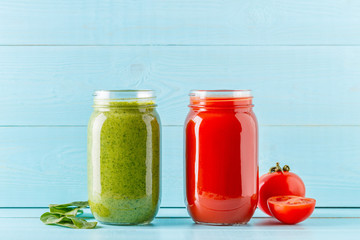 Green/red colored smoothies / juice in a jar