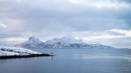 Fototapeta na wymiar Beautiful snow coverd landscape on a boat to Lofoten