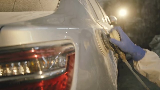 The grinding primered car surface with grind machine. 4K