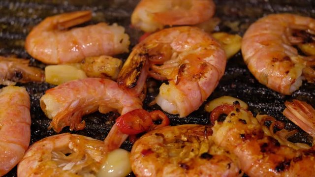 Fresh prawns with chilli and garlic on the grill