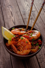 Large grilled BBQ shrimp with sweet chili sauce, green onion and lemon.