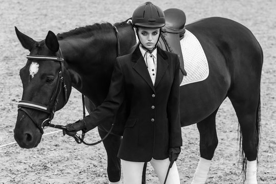 View from above young jockey with hourse in sport club